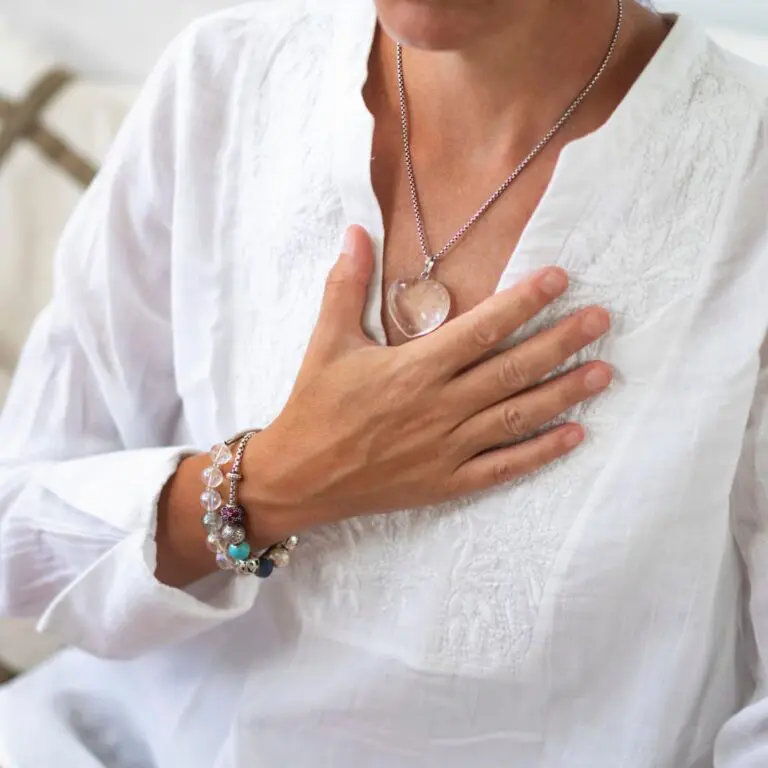 Woman practicing diaphragmatic breathing technique for nervous system regulation
