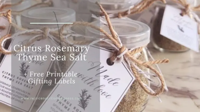 Homemade citrus rosemary thyme sea salt in small glass jars with festive ribbon and printable gift tags, ready for holiday gifting