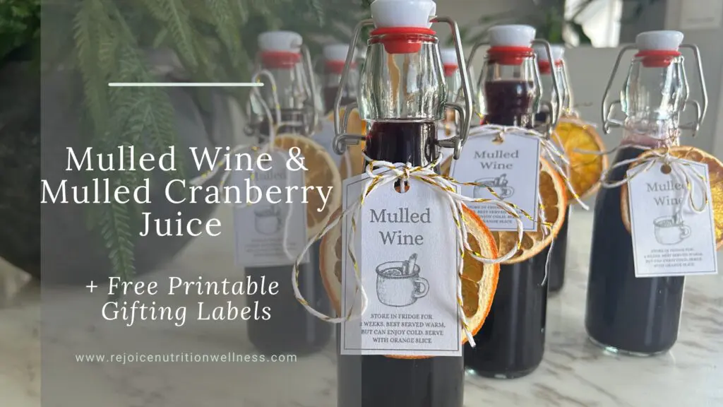 Warm mulled wine or mulled cranberry juice in glasses with orange slices and cinnamon sticks, perfect for holiday entertaining