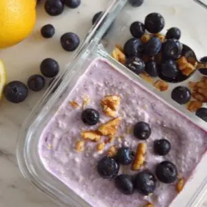 Easy high protein yogurt breakfast for perimenopause - Greek yogurt with nut butter, nuts, and berries to reduce cravings and balance hormones naturally