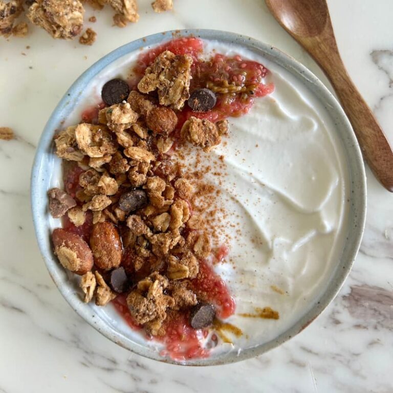 Beautiful PB&J granola bowl photographed from above showing colorful layers and textures
