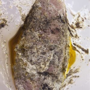 Greek lemon chicken marinade with fresh herbs and yogurt in freezer bag