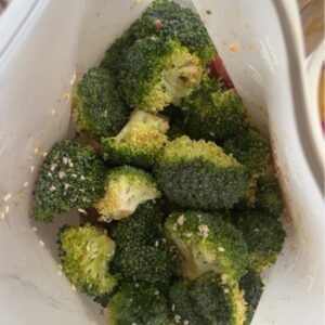 Beef and broccoli sheet pan dinner with tender beef strips, roasted broccoli, and sesame-ginger sauce
